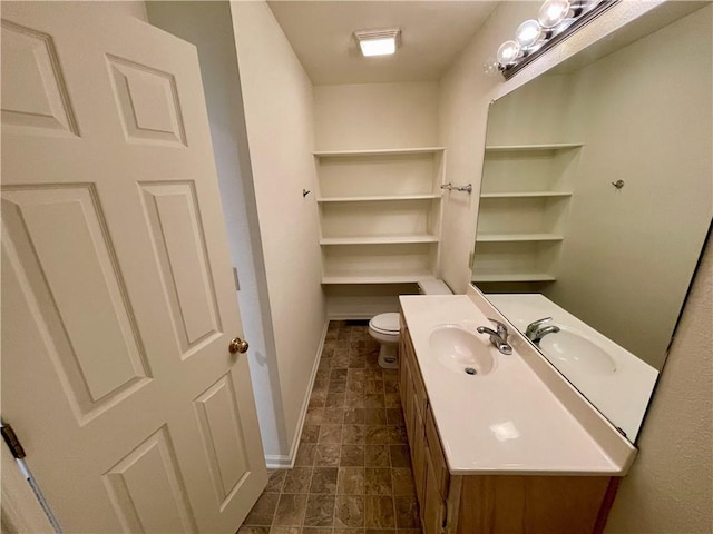 596 SE 105th Rd, Warrensburg, MO 64093 - bathroom featuring baseboards, vanity, and toilet