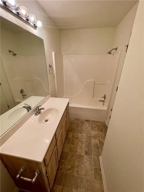 596 SE 105th Rd, Warrensburg, MO 64093 - bathroom featuring tub / shower combination and vanity