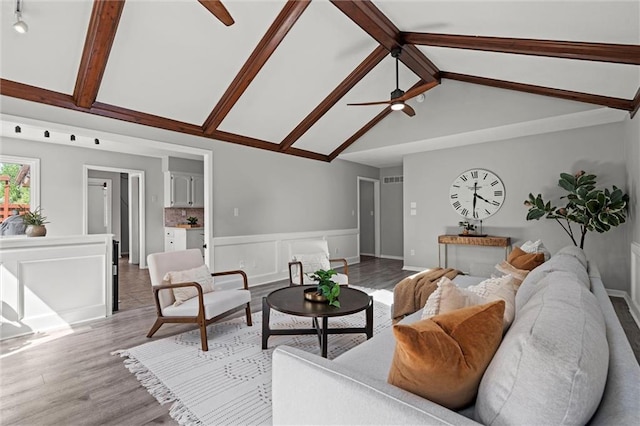 1036 NE Remington Ct, Lees Summit, MO 64086 - living room with a ceiling fan, light wood-style flooring, and baseboards