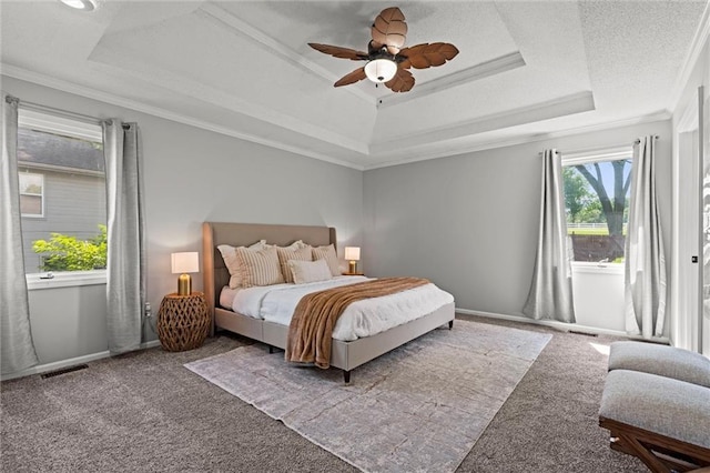 1036 NE Remington Ct, Lees Summit, MO 64086 - carpeted bedroom with a tray ceiling, ornamental molding, and a ceiling fan