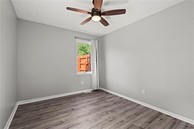1036 NE Remington Ct, Lees Summit, MO 64086 - empty room with wood finished floors, ceiling fan, and baseboards