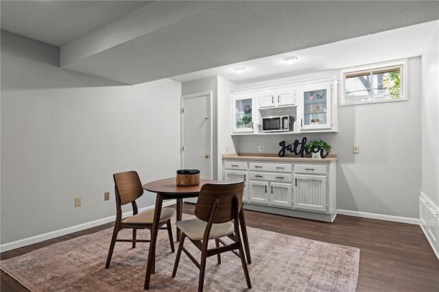 1036 NE Remington Ct, Lees Summit, MO 64086 - dining area with baseboards and dark wood-style floors
