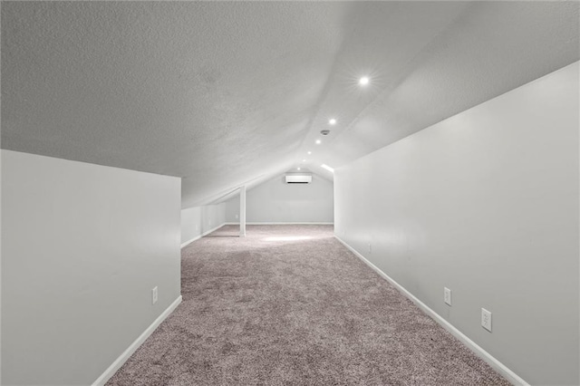 1036 NE Remington Ct, Lees Summit, MO 64086 - bonus room featuring carpet, vaulted ceiling, baseboards, recessed lighting, and a textured ceiling