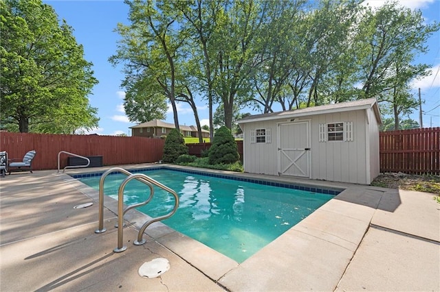 1036 NE Remington Ct, Lees Summit, MO 64086 - view of swimming pool featuring a fenced backyard, a shed, a patio, and an outdoor structure