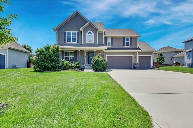 25201 W 149th Ter, Olathe, KS 66061 - view of front of home featuring driveway, stucco siding, and an attached garage