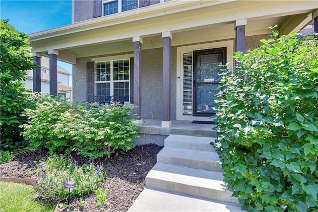 25201 W 149th Ter, Olathe, KS 66061 - property entrance with a porch and stucco siding