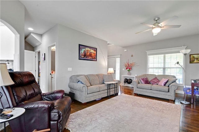 25201 W 149th Ter, Olathe, KS 66061 - living room featuring a ceiling fan, dark wood-style flooring, and arched walkways