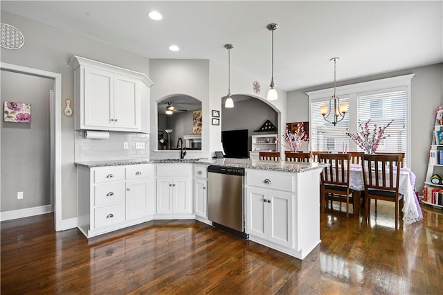 25201 W 149th Ter, Olathe, KS 66061 - kitchen with stainless steel dishwasher, ceiling fan, dark wood-style floors, white cabinets, and light stone counters