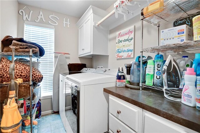 25201 W 149th Ter, Olathe, KS 66061 - laundry room with cabinet space, washing machine and dryer, and light tile patterned flooring