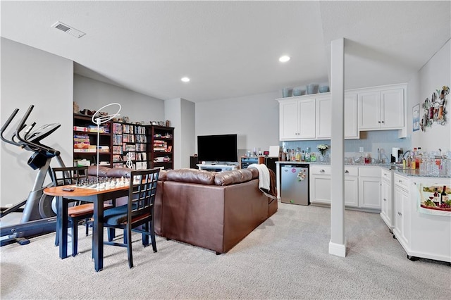 25201 W 149th Ter, Olathe, KS 66061 - living room with wet bar, light colored carpet, and recessed lighting