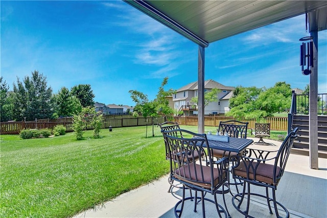 25201 W 149th Ter, Olathe, KS 66061 - fenced backyard with a patio area, outdoor dining area, and a residential view