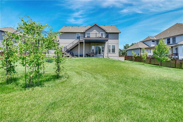 25201 W 149th Ter, Olathe, KS 66061 - rear view of property with stairs and a wooden deck