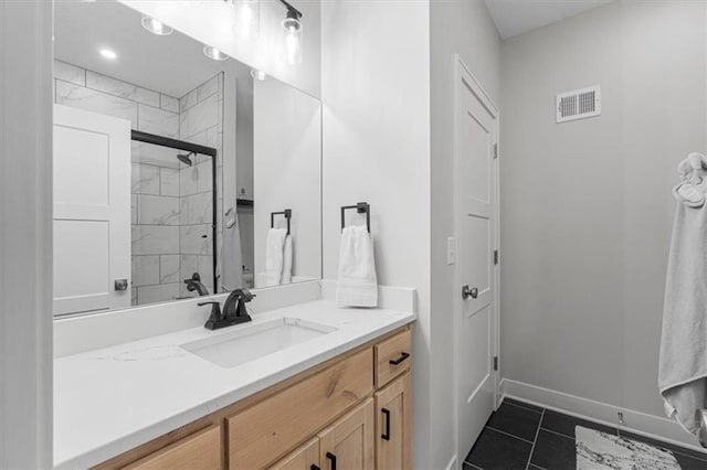 546 N Oakwood Ln, Tonganoxie, KS 66086 - bathroom with vanity, baseboards, a tile shower, and tile patterned flooring