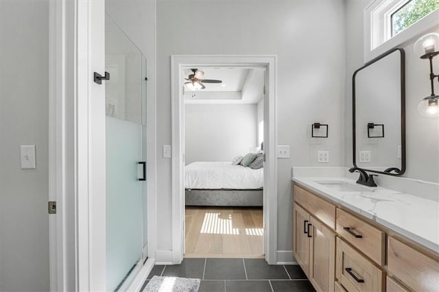 546 N Oakwood Ln, Tonganoxie, KS 66086 - full bathroom featuring a shower stall, ensuite bath, vanity, and tile patterned flooring