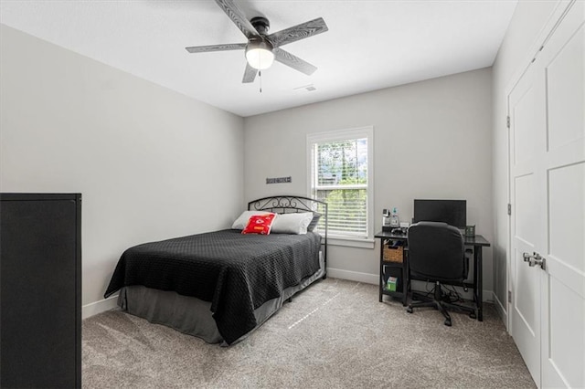 546 N Oakwood Ln, Tonganoxie, KS 66086 - bedroom with carpet, baseboards, a desk, and a ceiling fan