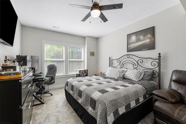 546 N Oakwood Ln, Tonganoxie, KS 66086 - bedroom with light colored carpet, a desk, a ceiling fan, and baseboards