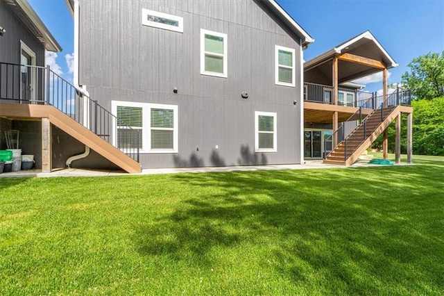 546 N Oakwood Ln, Tonganoxie, KS 66086 - rear view of property with stairs, a deck, a lawn, and a patio area