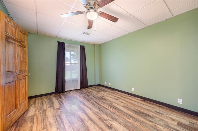 7277 SW Karen Rd, Trimble, MO 64492 - unfurnished room featuring a paneled ceiling, wood finished floors, baseboards, and ceiling fan