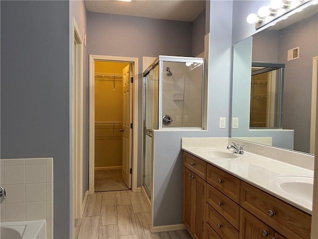2017 S 137th St, Bonner Springs, KS 66012 - full bath with a stall shower, a spacious closet, and double vanity
