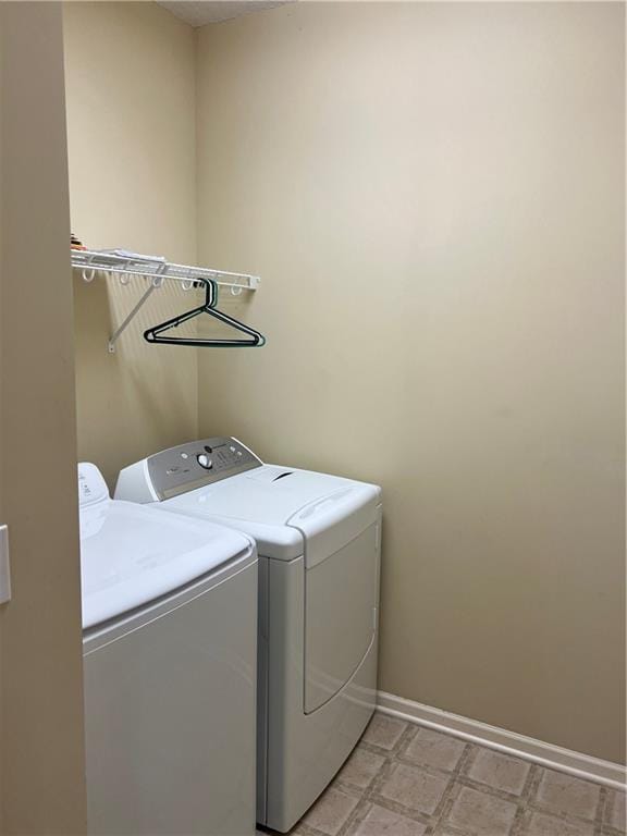 2017 S 137th St, Bonner Springs, KS 66012 - laundry room with separate washer and dryer and baseboards