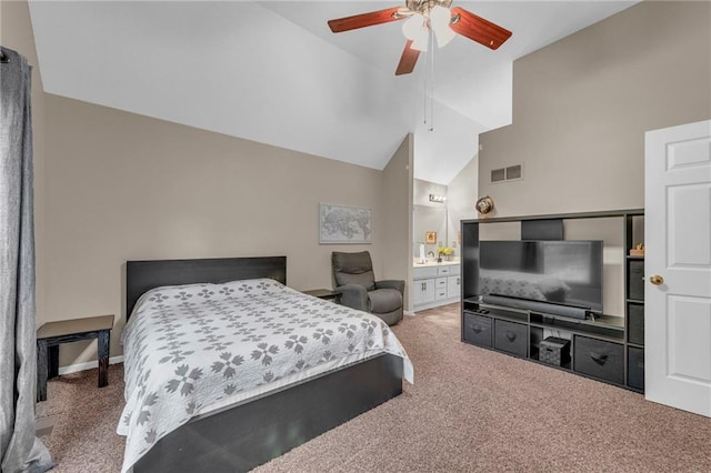 carpeted bedroom with vaulted ceiling, a ceiling fan, ensuite bathroom, and baseboards