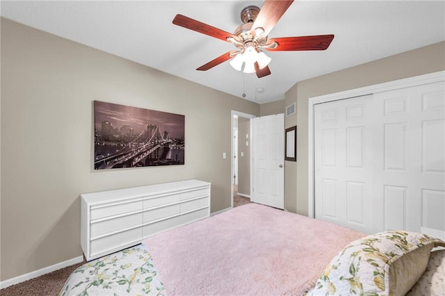 bedroom with carpet floors, baseboards, a closet, and ceiling fan