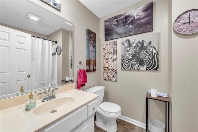 bathroom featuring toilet, vanity, baseboards, tile patterned floors, and curtained shower