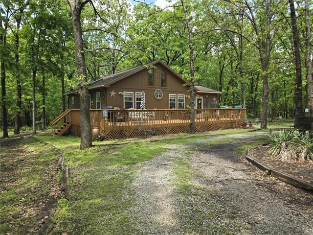 27349 Karrs Park Ave, Warsaw, MO 65355 - view of front of property featuring a deck, driveway, and a forest view