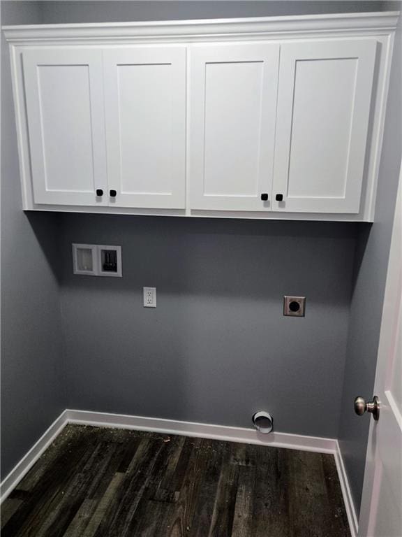 449 E Market St, Warrensburg, MO 64093 - laundry area featuring hookup for an electric dryer, dark wood-style floors, hookup for a washing machine, and cabinet space