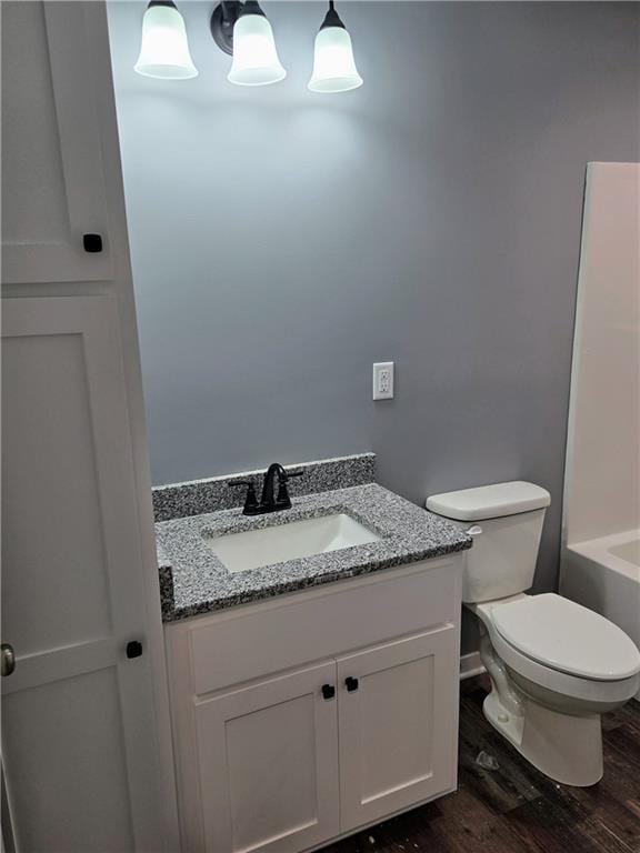 449 E Market St, Warrensburg, MO 64093 - bathroom featuring vanity and wood finished floors