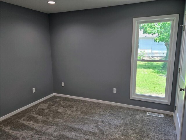 449 E Market St, Warrensburg, MO 64093 - unfurnished room featuring dark carpet and recessed lighting
