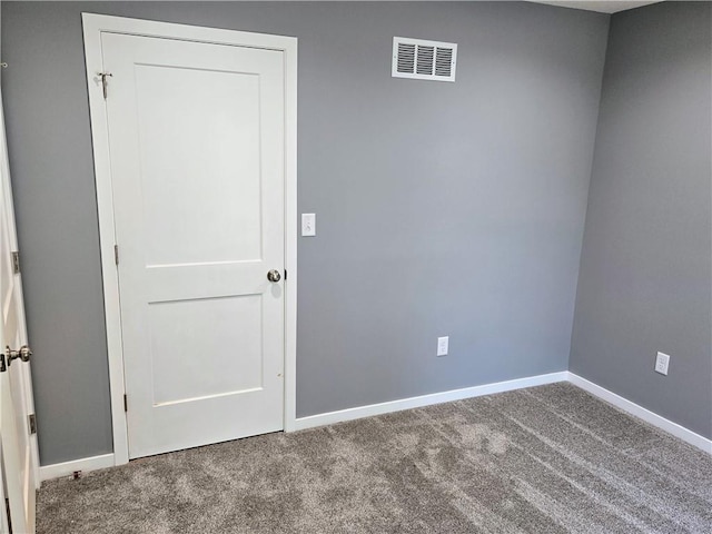 449 E Market St, Warrensburg, MO 64093 - carpeted empty room featuring baseboards