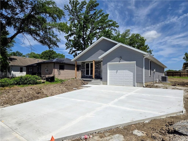 449 E Market St, Warrensburg, MO 64093 - ranch-style house with a garage and driveway