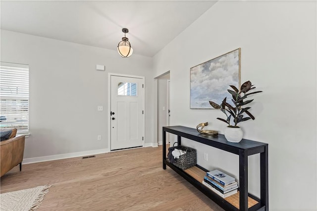 402 Woodview Dr, Raymore, MO 64083 - foyer entrance featuring light wood-style floors and baseboards