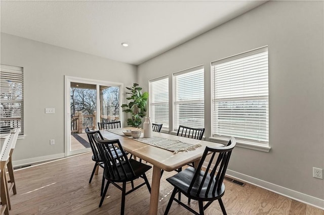402 Woodview Dr, Raymore, MO 64083 - dining space with light wood-style floors, baseboards, and recessed lighting