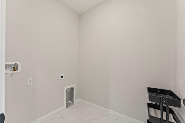 402 Woodview Dr, Raymore, MO 64083 - clothes washing area featuring hookup for an electric dryer, washer hookup, baseboards, and light marble finish floors