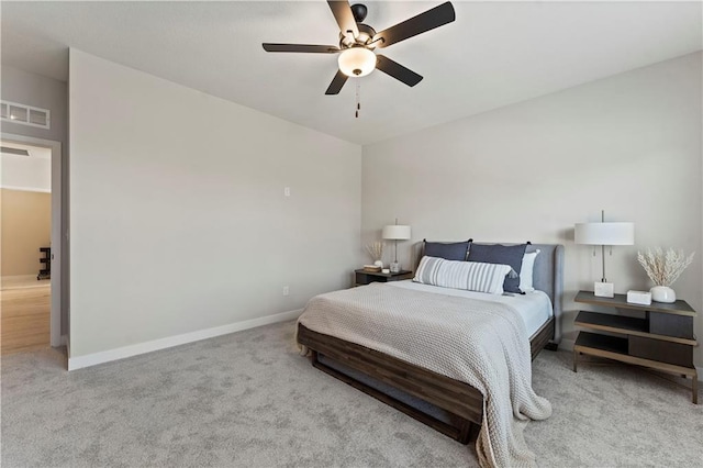 402 Woodview Dr, Raymore, MO 64083 - carpeted bedroom with baseboards and a ceiling fan