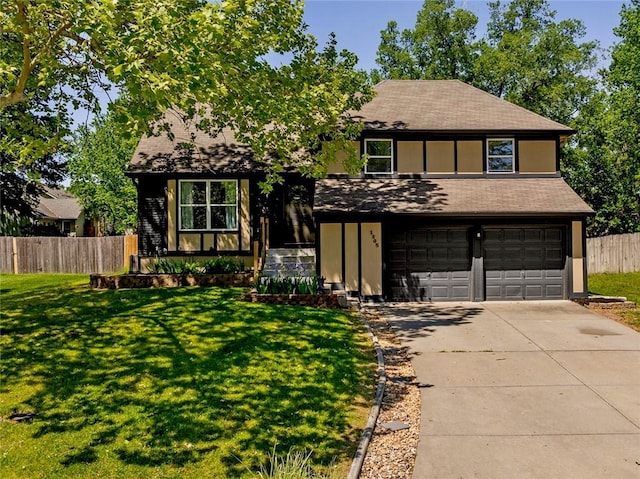 view of front of house featuring an attached garage, driveway, and a shingled roof