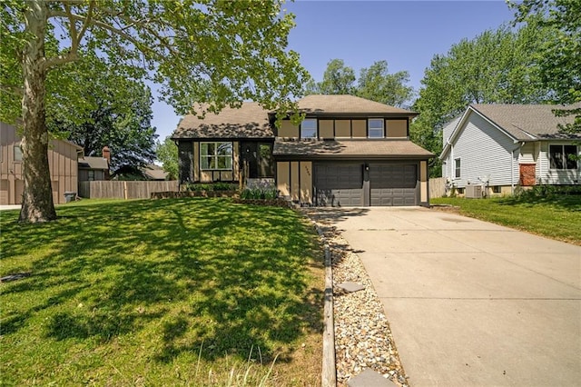 view of front of home featuring concrete driveway and an attached garage