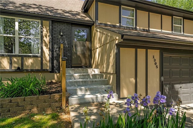 property entrance featuring a garage, brick siding, and a shingled roof