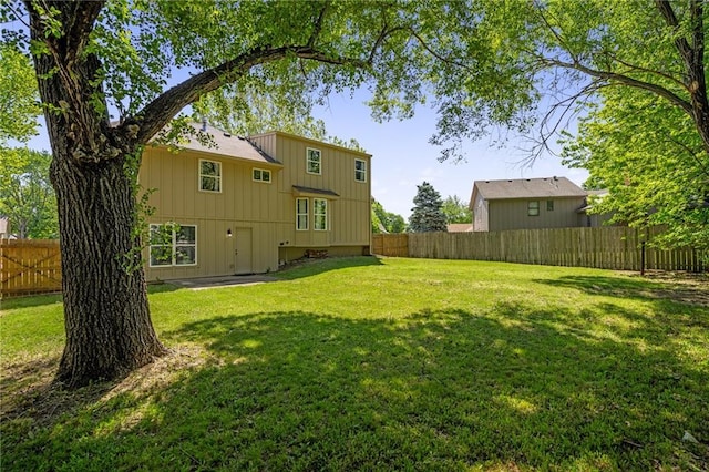 rear view of house featuring board and batten siding