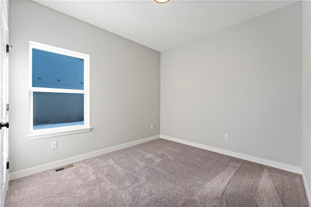 501 Woodview Dr, Raymore, MO 64083 - carpeted spare room featuring baseboards