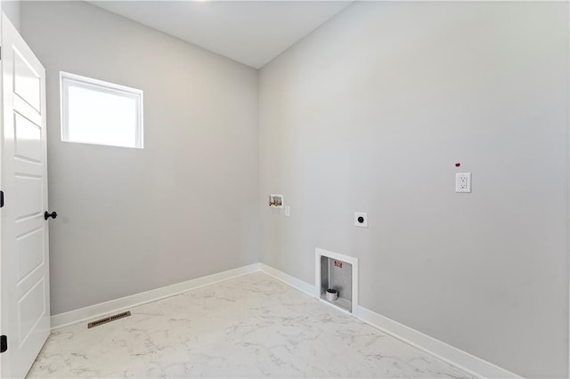 501 Woodview Dr, Raymore, MO 64083 - washroom with marble finish flooring, electric dryer hookup, washer hookup, and baseboards
