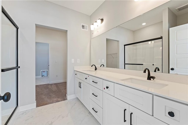 501 Woodview Dr, Raymore, MO 64083 - full bathroom with marble look tile flooring, baseboards, double vanity, and a walk in closet