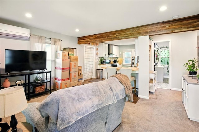 living room with an AC wall unit, recessed lighting, baseboards, and light carpet
