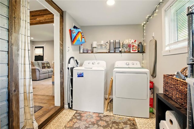 washroom featuring washing machine and clothes dryer and recessed lighting