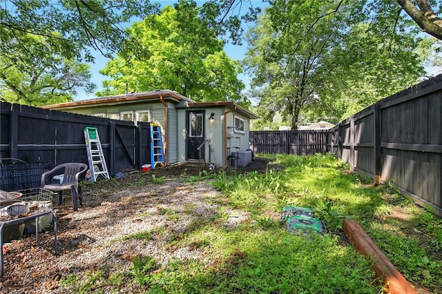 fenced backyard with an outdoor structure
