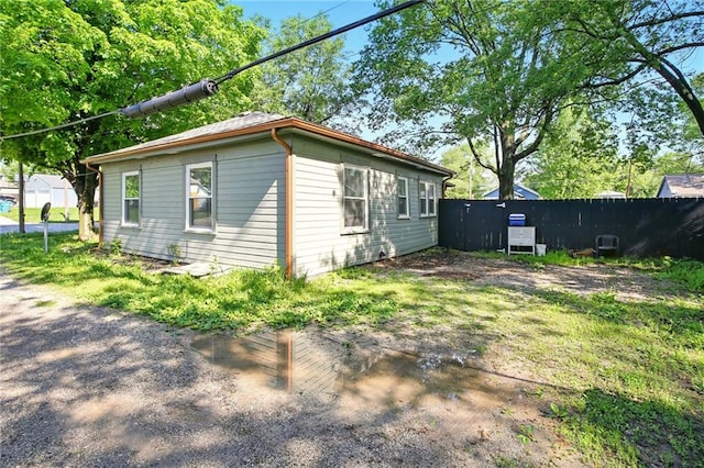 view of property exterior with fence