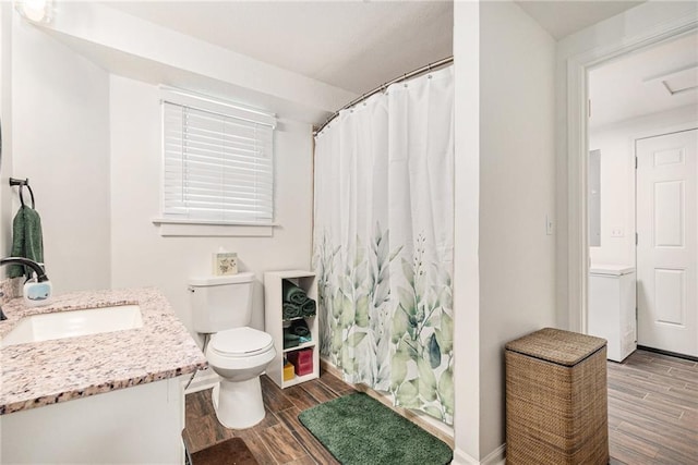 bathroom featuring wood finish floors, toilet, and a shower with curtain