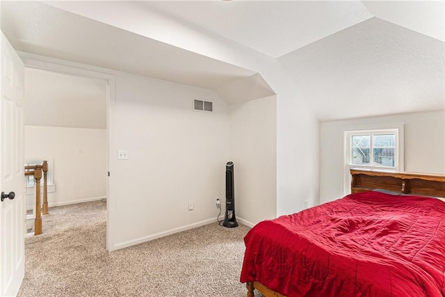 bedroom featuring carpet flooring, vaulted ceiling, and baseboards